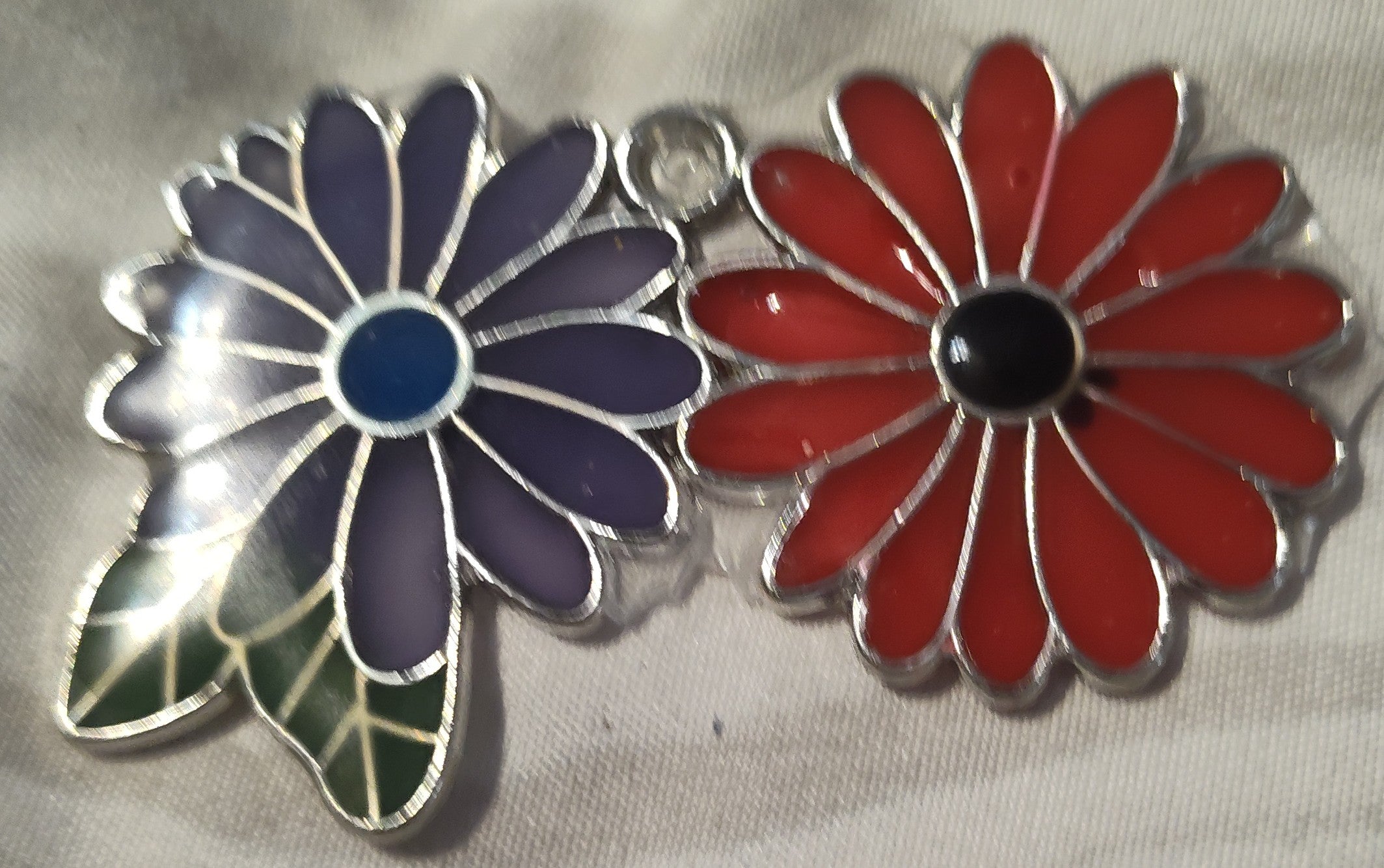 Double Flower (lavender and blue center and red and black center with green leaves) Pendant